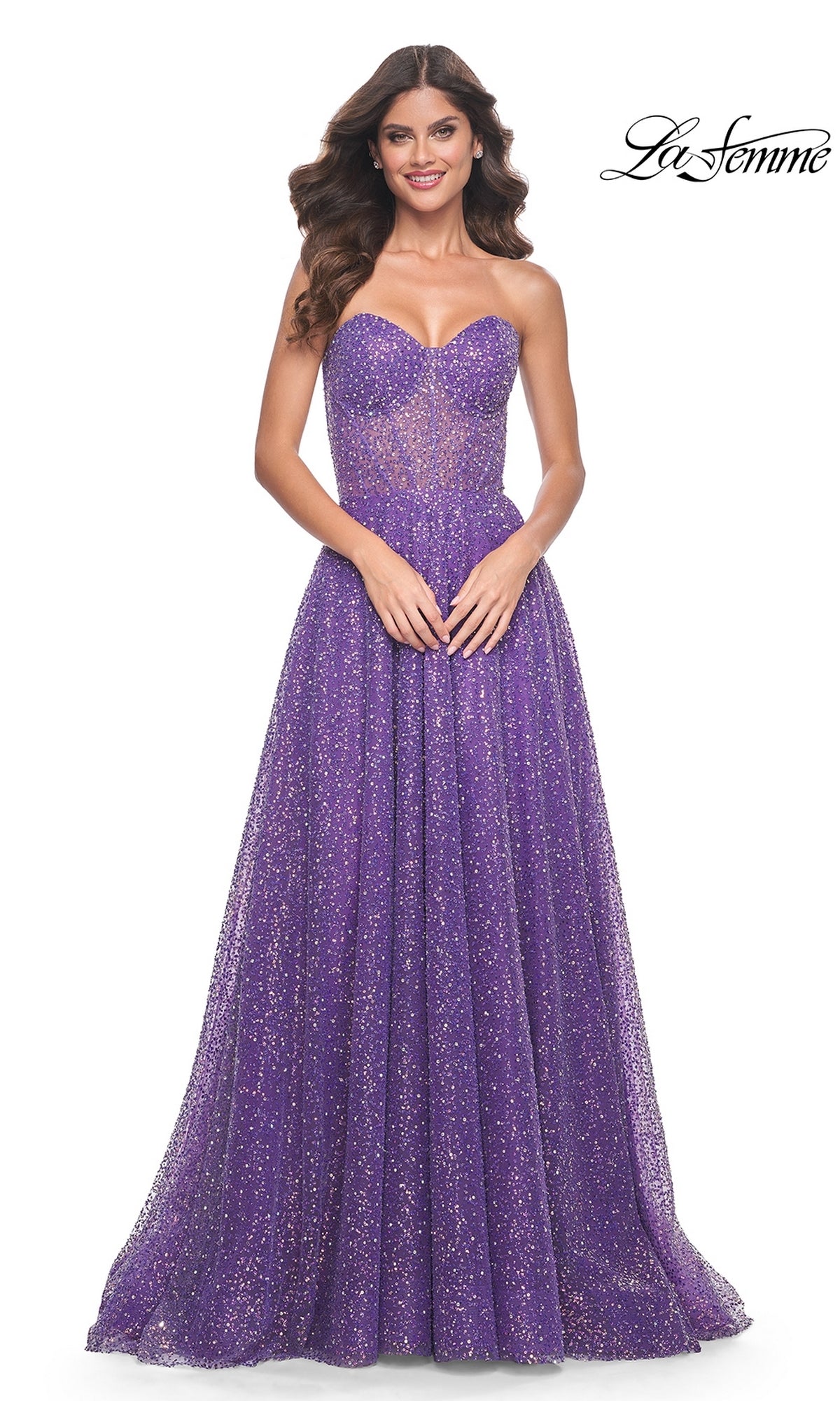 A woman poses against a white background wearing the La Femme Strapless Embellished Prom Dress 32136, a long purple glitter a-line gown. The La Femme logo appears in the top right corner.